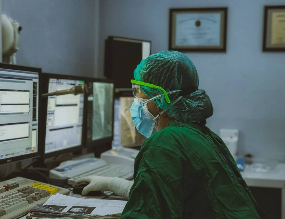 Medical person working on a computer